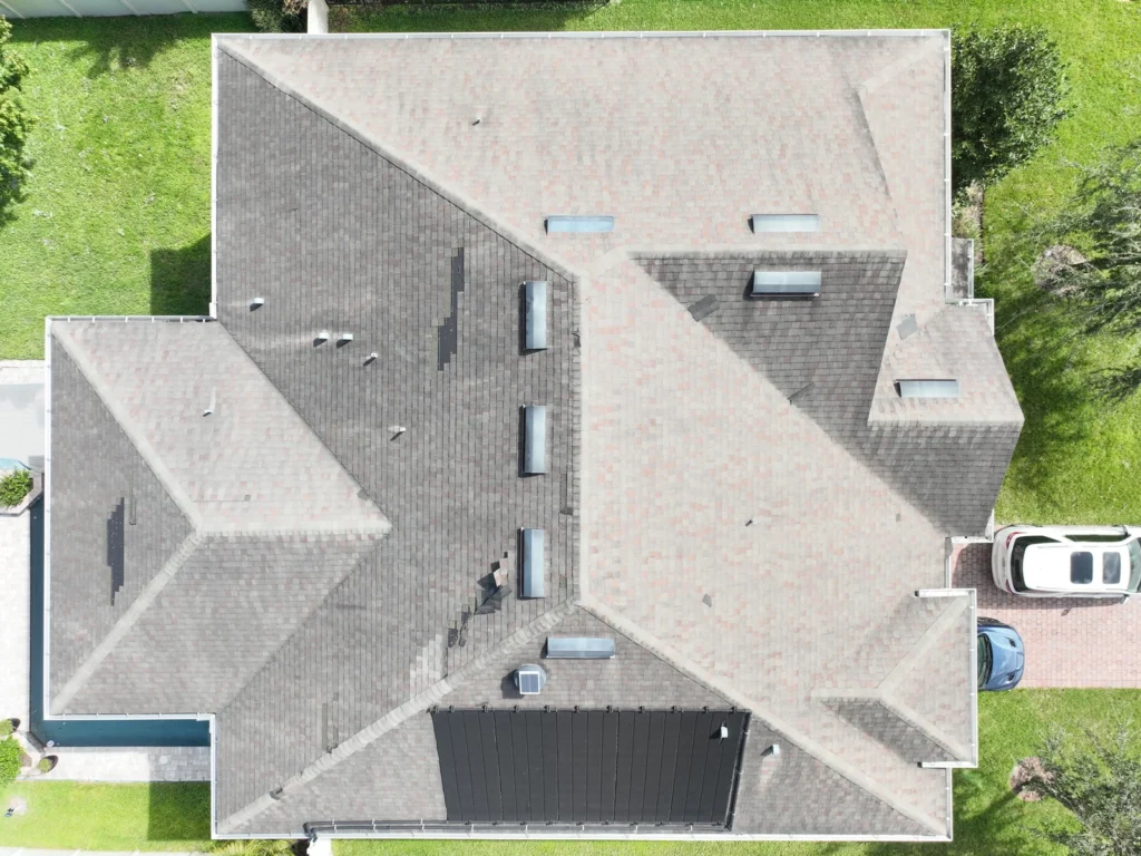 Overhead view of roof planes, vents and dark patches at Magnolia Park Estates