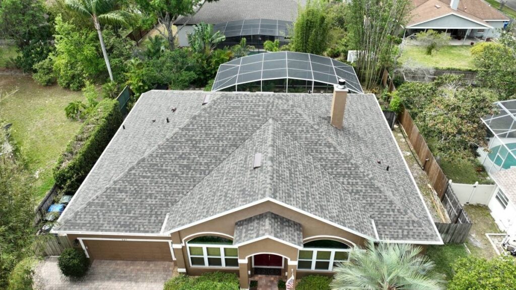 Aerial view of a completed shingle roof on a Florida home